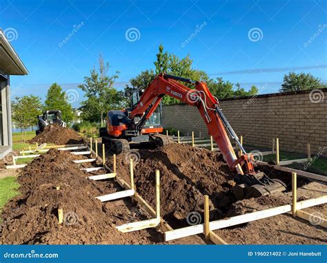 Image result for Backhoe Digging Hole