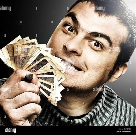 Person, man, money, happy expression Stock Photo - Alamy