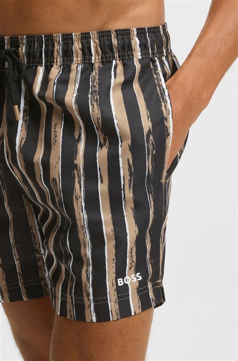 BOSS - Quick-dry swim shorts with all-over print - Black / Beige