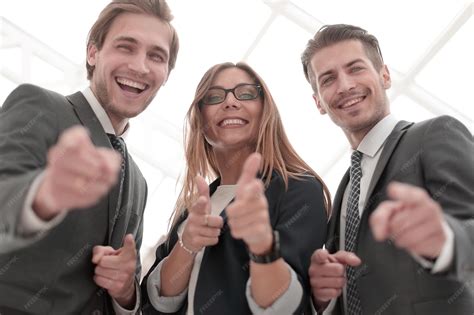 Group of People Standing in Office Pointing 的图像结果