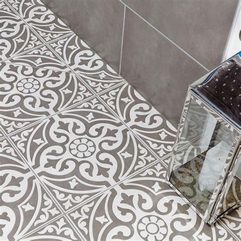 A traditional looking grey patterned feature floor tile designed with a ...