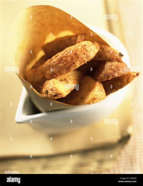 Thick cut fries in paper Stock Photo - Alamy