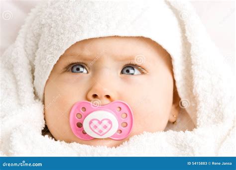 Baby girl with pacifier stock image. Image of little, peace - 5415883