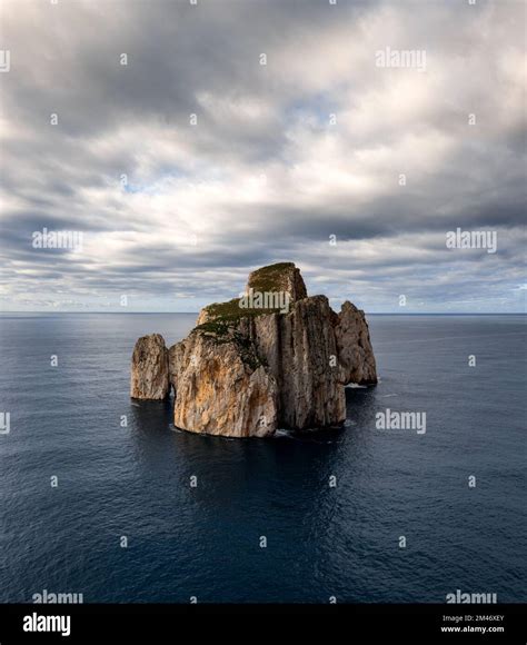 A view of the Pan di Zucchero sea stack in Porto Flavia on Sardinia ...