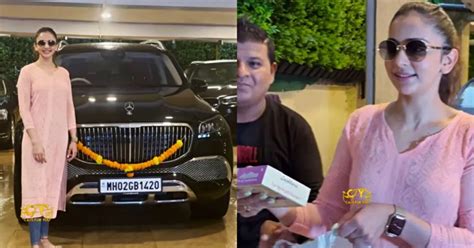 Bollywood actress Rakul Preet poses with her brand new Mercedes Maybach ...