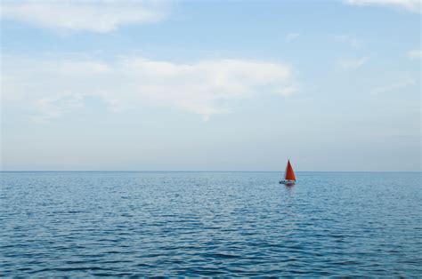 Orange Sailboat on Body of Water · Free Stock Photo