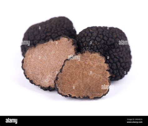 Black truffles isolated on a white background. Fresh sliced truffle ...