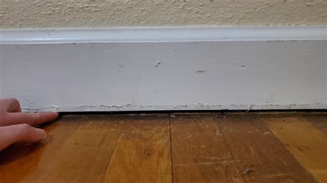 Gap between baseboard and floor : r/Flooring