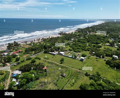 The ocean waves touching the coastline with the green beach view, Playa ...