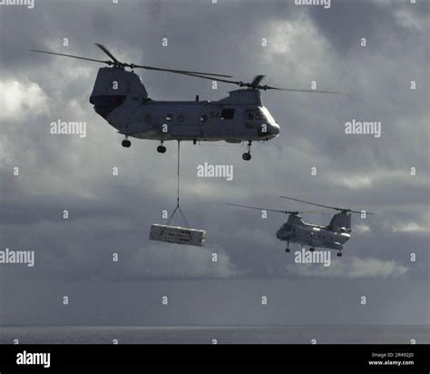 US Navy Two CH-46 Sea Knight helicopters transfer ordnance Stock Photo ...