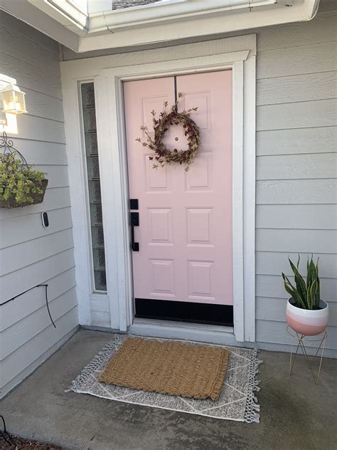 White Brick Exterior With Pink Doors