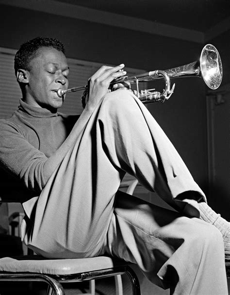 Download Legendary Jazz Bandleader Miles Davis Performing Wallpaper ...