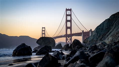 Wallpaper bridge, rocks, shore, beach, ocean hd, picture, image