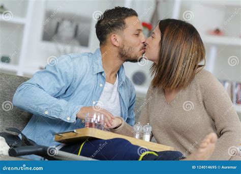 Lady Kissing Man with Leg in Splint Stock Image - Image of optimistic ...