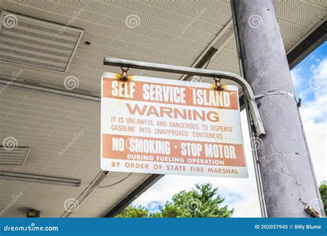 Old Gas Pump Warning Sign at a Closed Gas Station Editorial Image ...