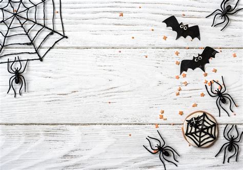Premium Photo | Halloween background with cookie spiders and bats top view