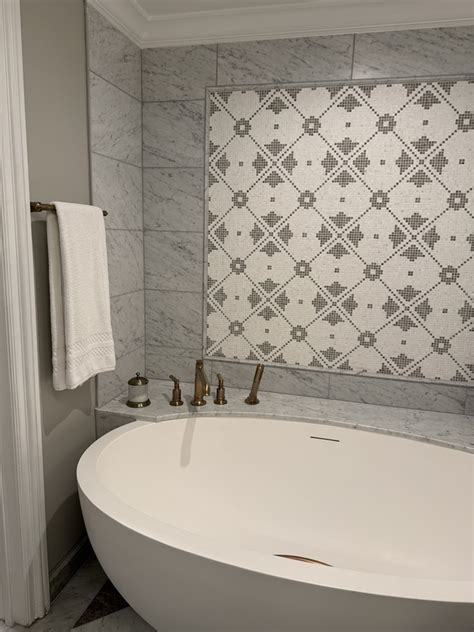 The Ritz-Carlton bath robes hanging in luxury bathroom