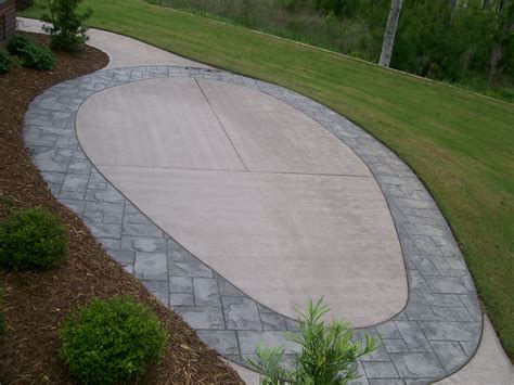 Concrete Stamped Border Driveway With Broom Finish Interior.