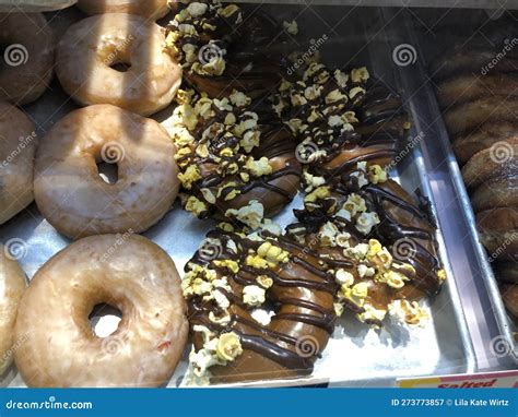 Chocolate Covered Donuts with Popcorn, and Glazed Donuts Stock Image ...