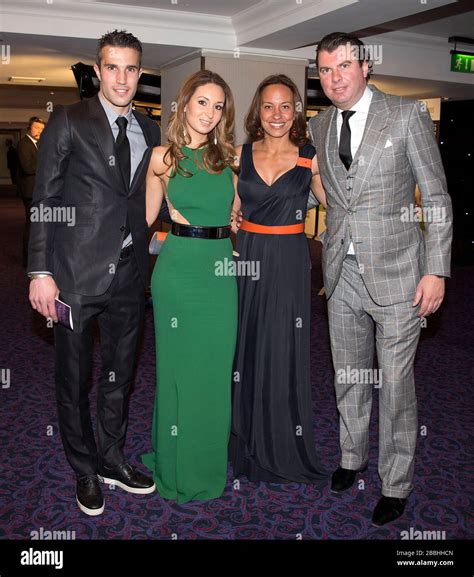 Robin Van Persie (left) his wife Bouchra (centre left) pose for a ...