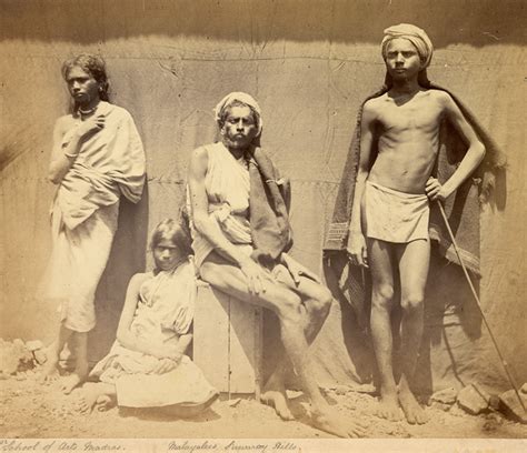 Photograph of two men and two women of the Malaiyali tribe in the ...