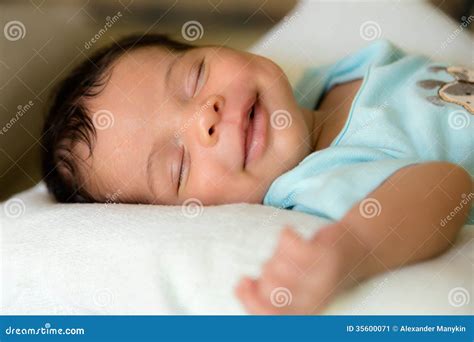 Sleeping smiling babyboy stock image. Image of lying - 35600071