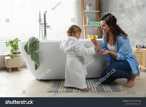 Mother Playing Her Daughter Near Tub Stock Photo 2294405189 | Shutterstock