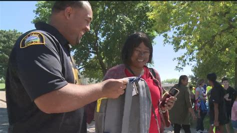 National Black Police Association hosts 'Backpacks & Barbers' | kare11.com