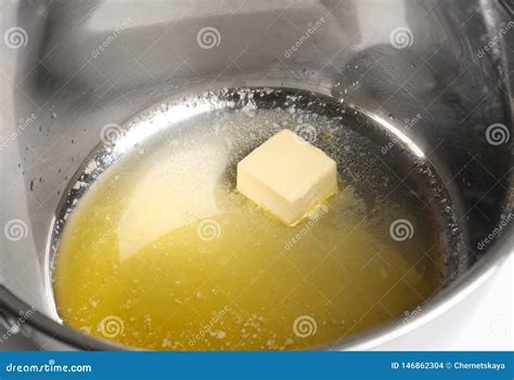 Piece of Melting Butter in Pot Stock Photo - Image of melt, ingredient ...