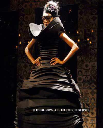 Designer Rohit Bal on the ramp with models after presenting his ...