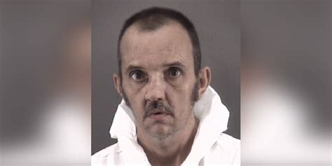 Man charged with murder after setting mom on fire, police say