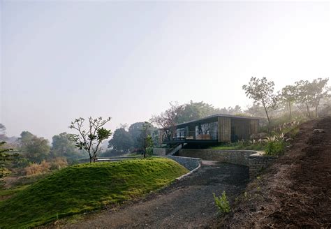 A Riverfront Home in the Ghats is Camouflaged With a Green Roof