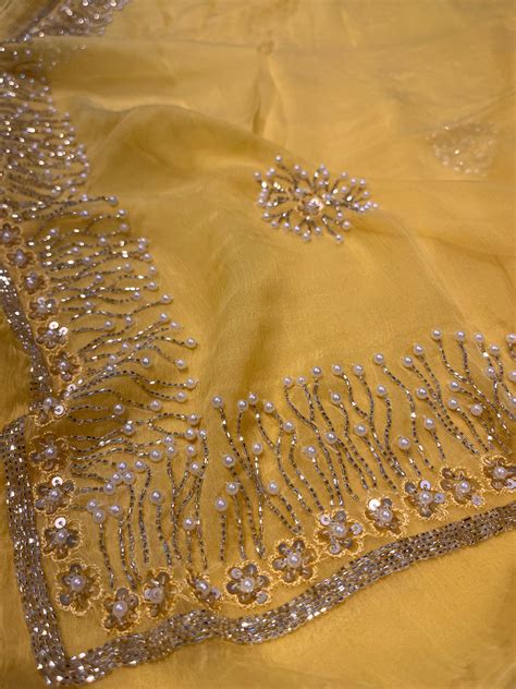 YELLOW COLOUR CHIFFON HAND EMBROIDERED SAREE EMBELLISHED WITH CUTDANA ...