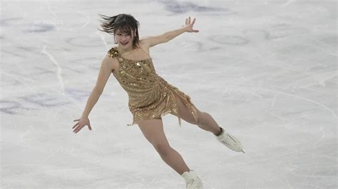 Feb 19, 2026; Milan, Italy; Alysa Liu of the United States celebrates with the gold medal in the women's free skate during the Milano Cortina 2026 Olympic Winter Games at Milano Ice Skating Arena. Mandatory Credit: James Lang-Imagn Images