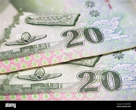 Macro detail with a 20 Thai Baht banknote. the baht is the official currency of Thailand Stock ... - currency of thailand