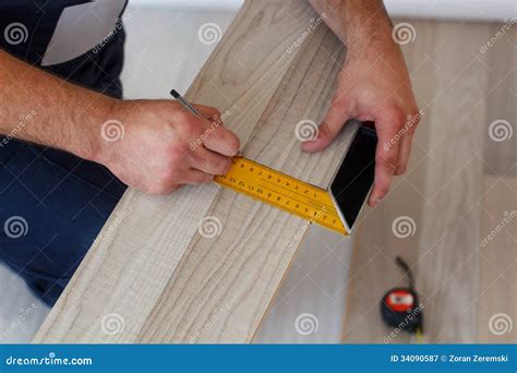 Laying laminate flooring stock image. Image of house - 34090587