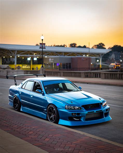 Blue R34 Nissan Skyline Sedan at Sunset - BenLevy.com