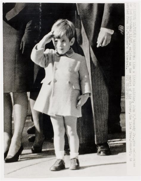 [John F. Kennedy Jr. saluting his father