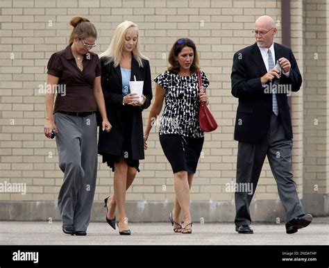 Karen Cunagin Sypher, second from left, walks with two unidentified ...