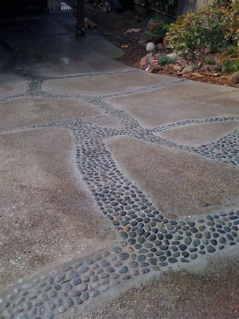 A creative, low cost way to deal with a cracking driveway. First you ...