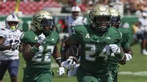 USF linebacker Mac Harris lighting it up, and lighting the way
