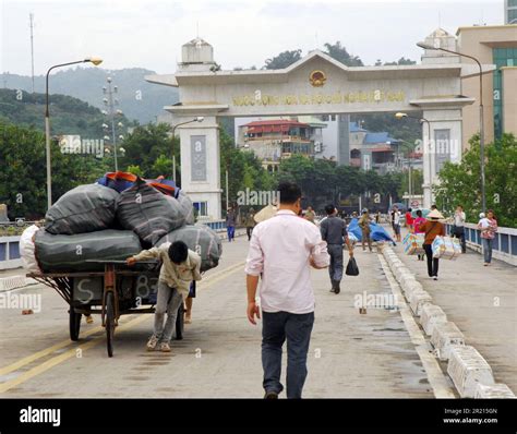 The border crossing between Hekou, Yunnan, China and Lao Cai, Vietnam. border gate on the ...