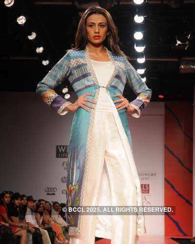 Neha Kapur displays a creation by designer Anita Dongre during the ...