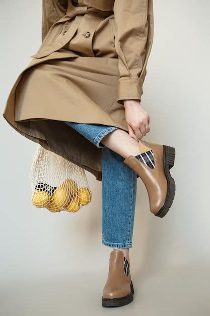 A girl model in pink clothes in the studio shooting fashionable clothes ...
