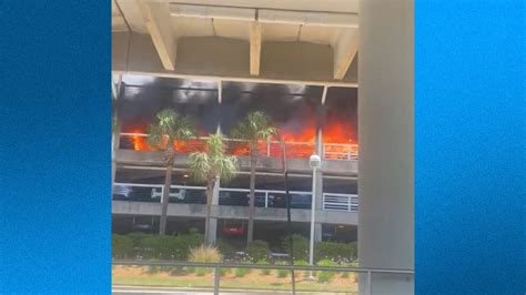 Watch fire at parking garage close Jacksonville International Airport