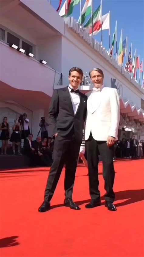 Mads Mikkelsen showing his son Carl Jacobsen during the 80th Venice ...