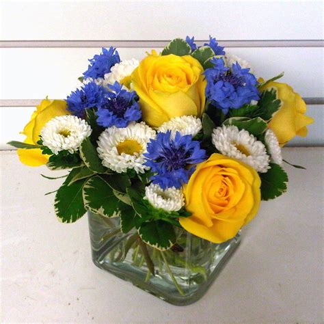 Yellow, White and Blue Flower Arrangements