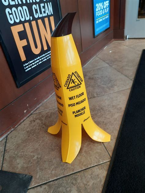 Banana wet floor sign at Dave and Buster's : r/bananawetfloorsign