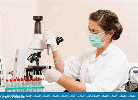 Laboratory Assistant with Dispenser in Laboratory Doing Blood Test Analysis. Medical Equipment ...
