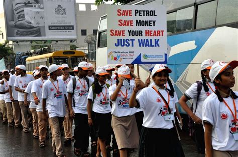 Senior citizen and students take part in a walkathon World Heart Day